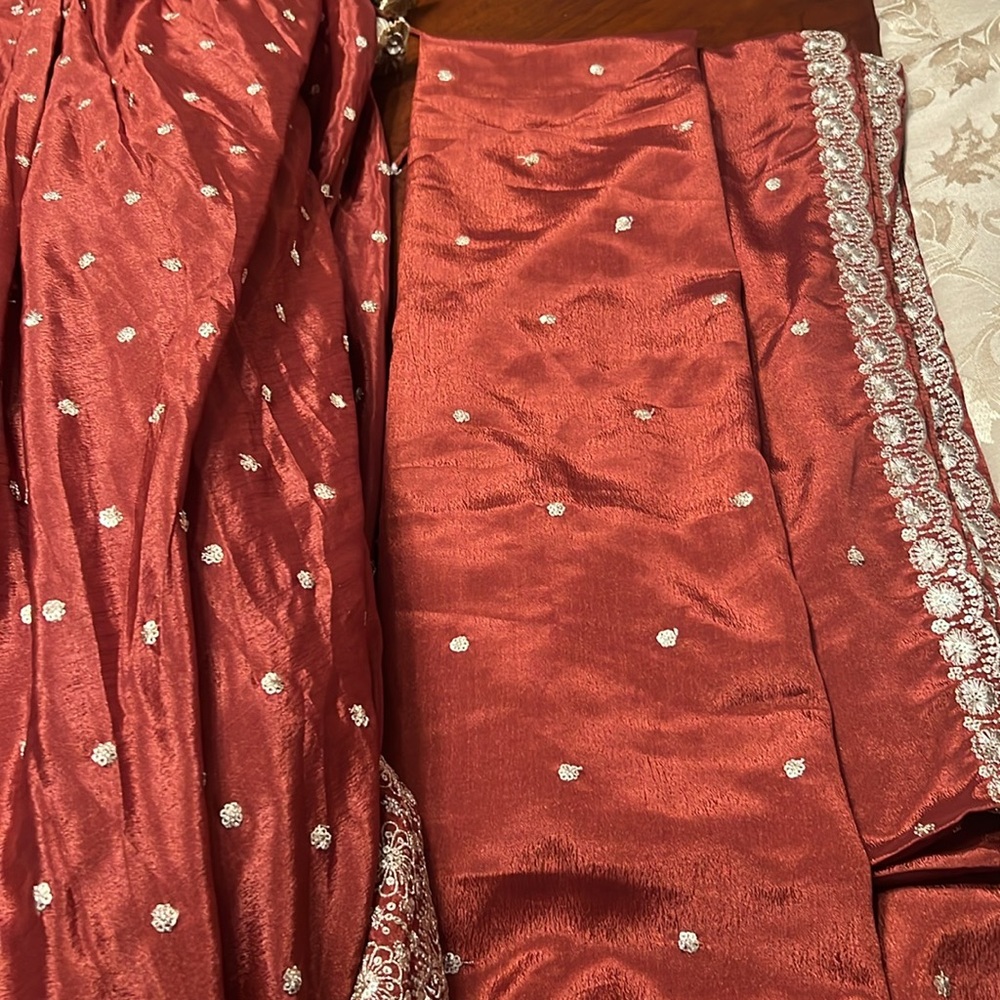Elegant rust color lehenga with long top with crystal work - Picture 13 of 15